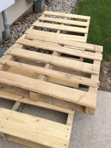 The pallets before they were torn up and used for a pallet wall.