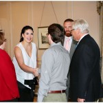 Lindsey (white) and John Kuhn greet arriving guests