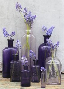 Ultra violet purple vases and lilac flowers