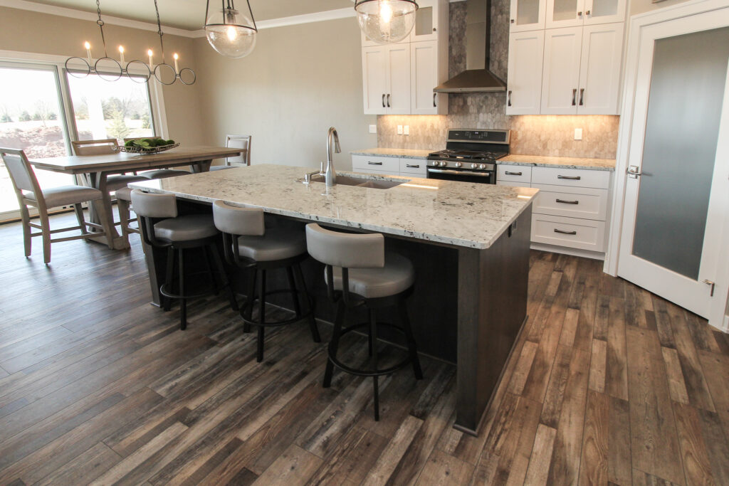 Kitchen with Tan Luxury Tile Flooring and Tiled Backsplash