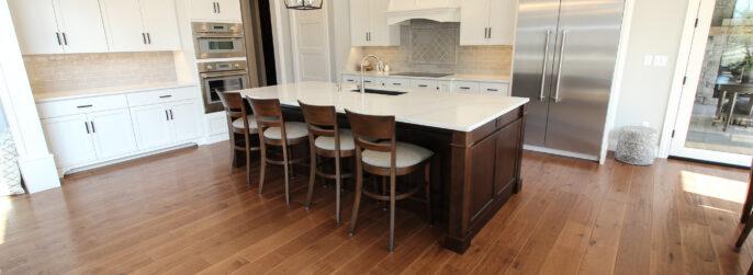 Kitchen with Hardwood Flooring and Tile Backsplash